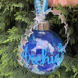 Decorative ornament with 'Archie' on a tree