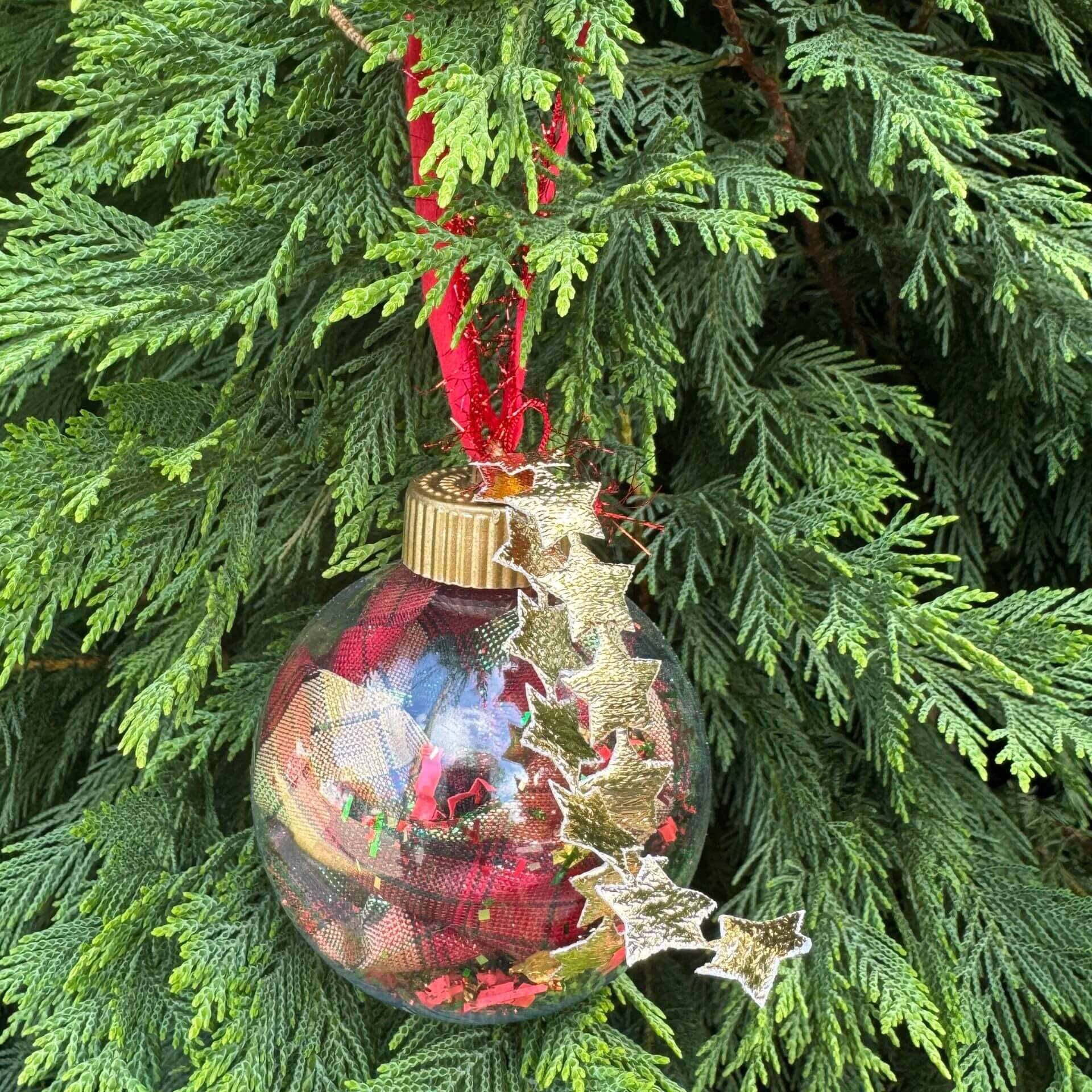 Decorative Christmas ornament with stars hanging on a tree