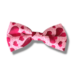Dog bow with hearts fashion accessory, let's pawty