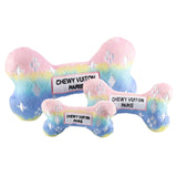 Bone-shaped dog toy with rainbow pattern and 'Chewy Vuiton Paris' label on a white background